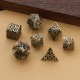 Kit De 7 Dés Métalliques Entrelacés Creux Teinte Bronze